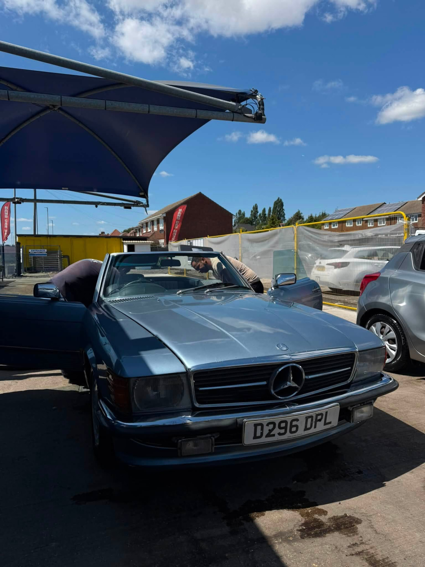 Classic Mercedes SL convertible being valeted by the team